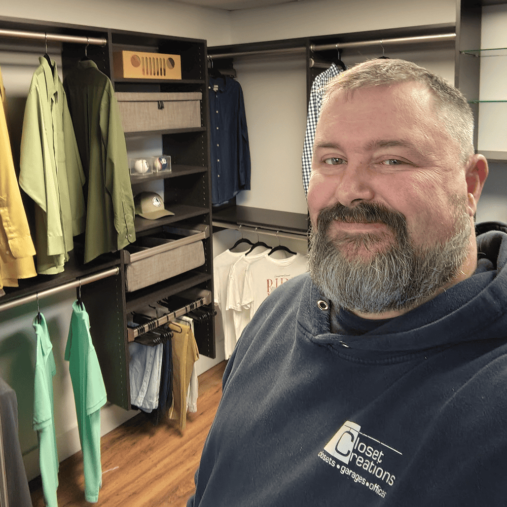 Interior view of Closet Creations clothing store with racks of apparel and accessories.