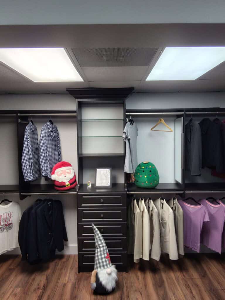 Custom closet organization with clothing and accessories.