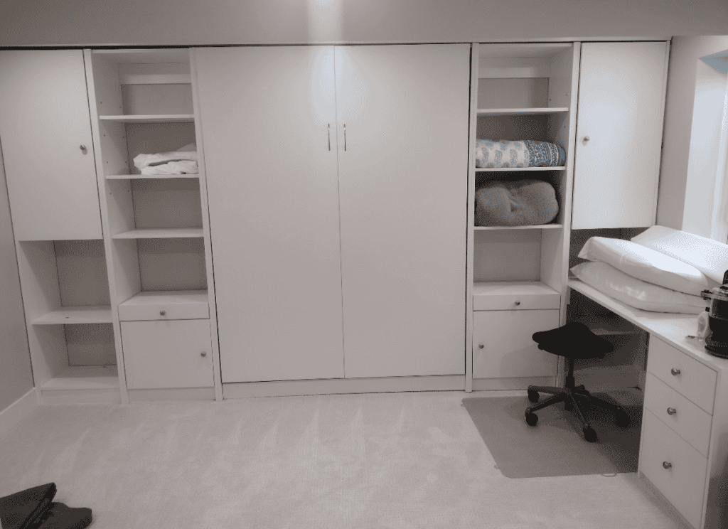 Custom closet storage with shelves, drawers, and cabinets for organized space.