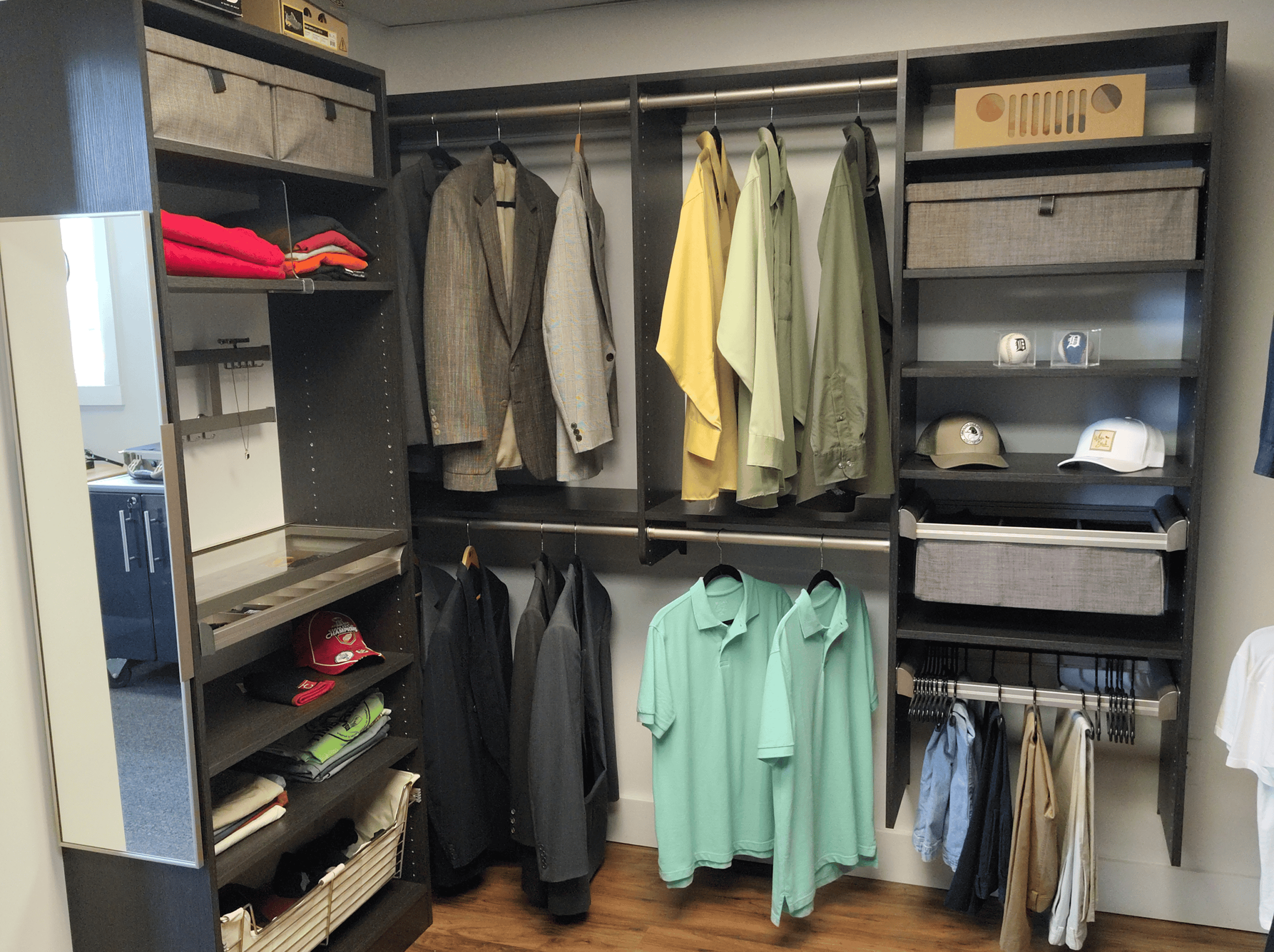 Custom closet organization with clothing, accessories, and storage solutions for a tidy space.