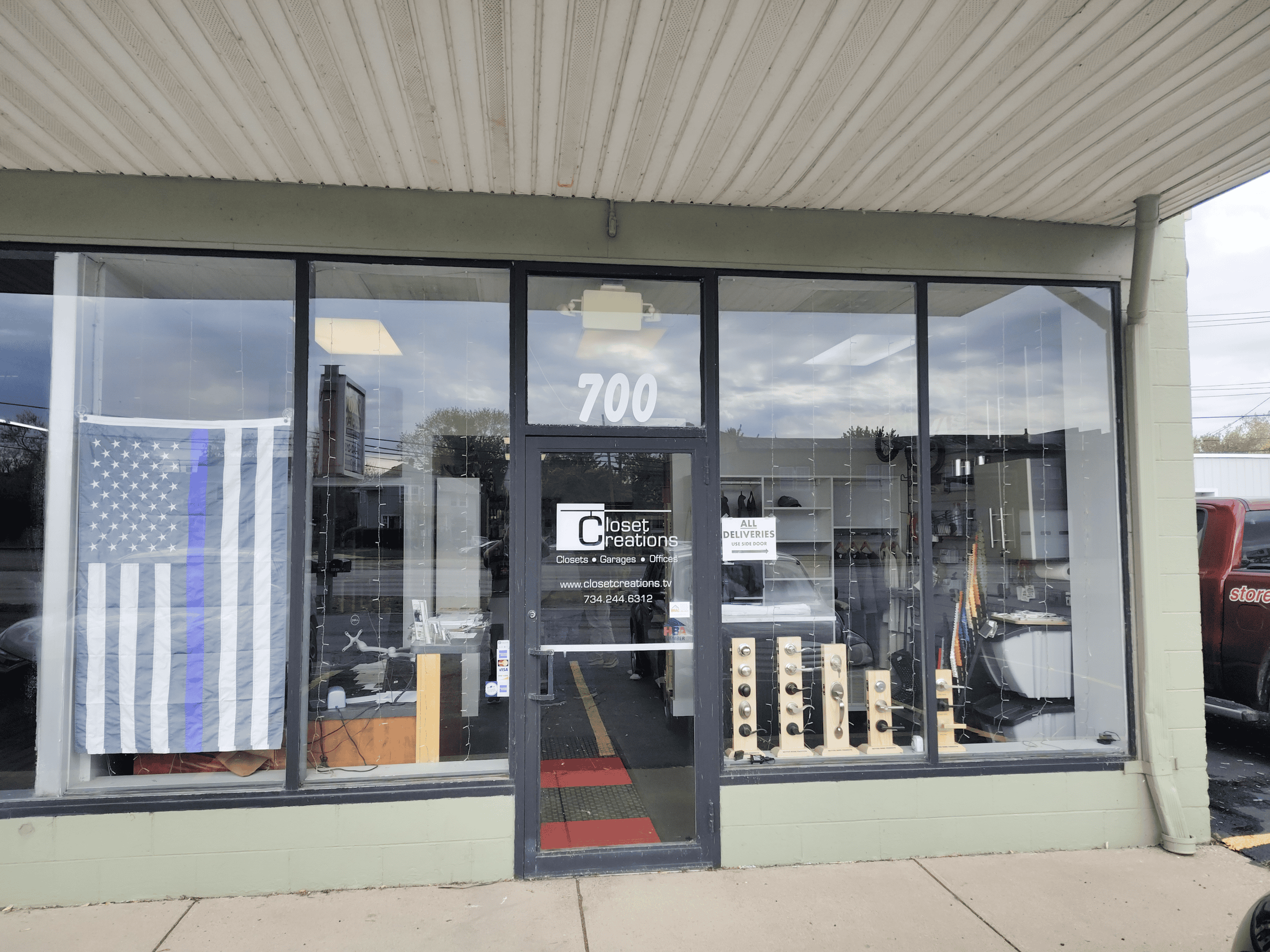 Exterior view of Closet Creation storefront with glass windows and entrance door in en_US.